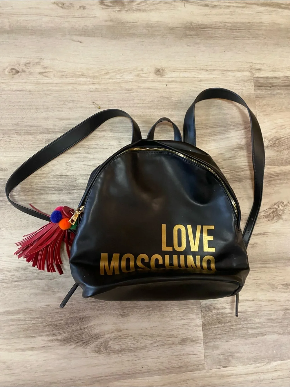 Love Moschino Black Backpack with Gold Logo and Red Tassel